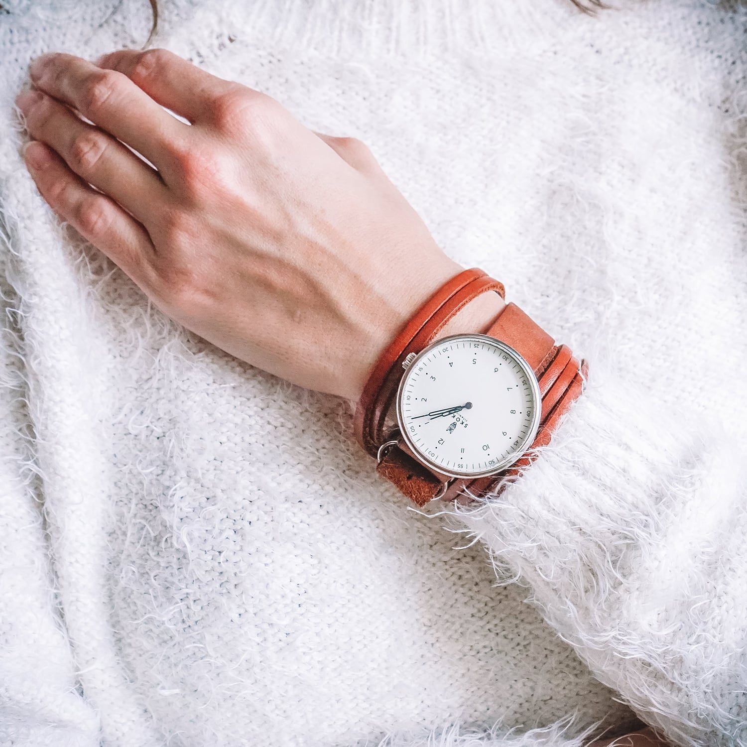 SKOKA Ti-01 titanium watch with a light dial and brushed case